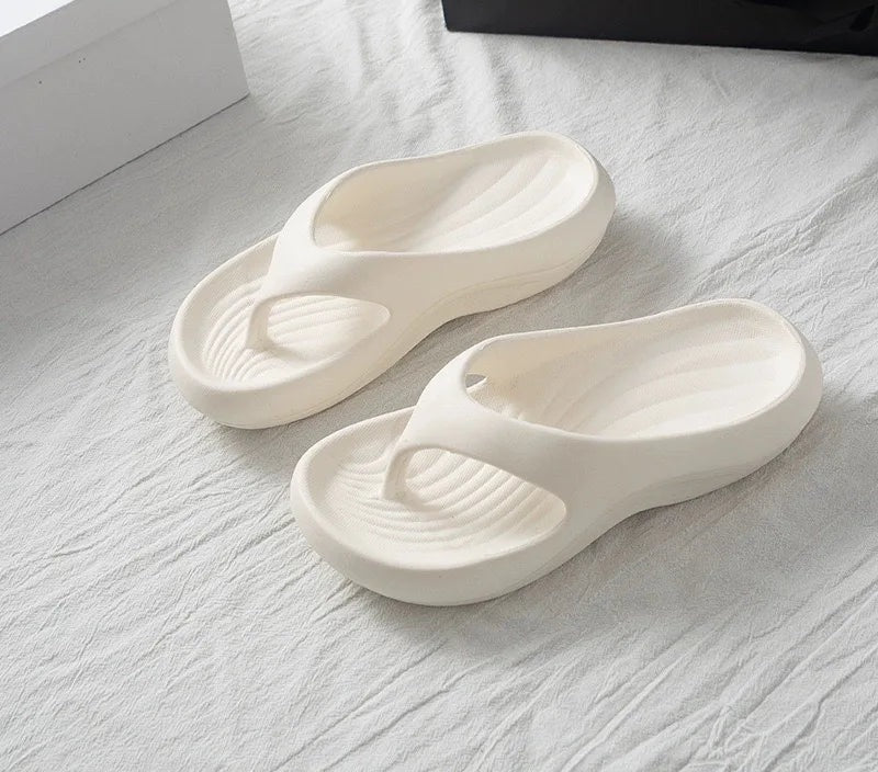 EVA flip flops with a ridged footbed and a thick curved sole - cream