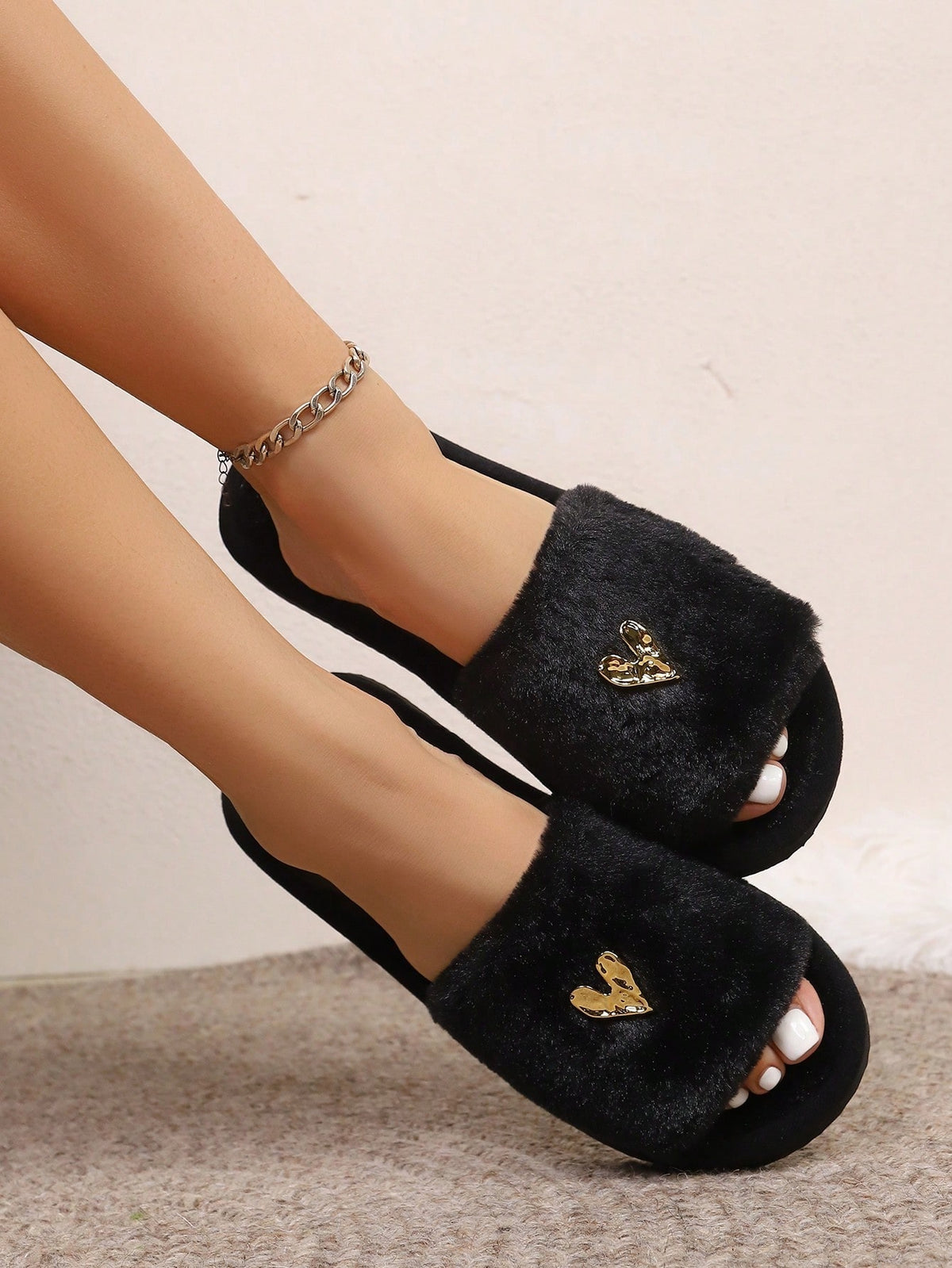 Fluffy sliders for women with a wide black plush strap and a small gold heart on top - view 6