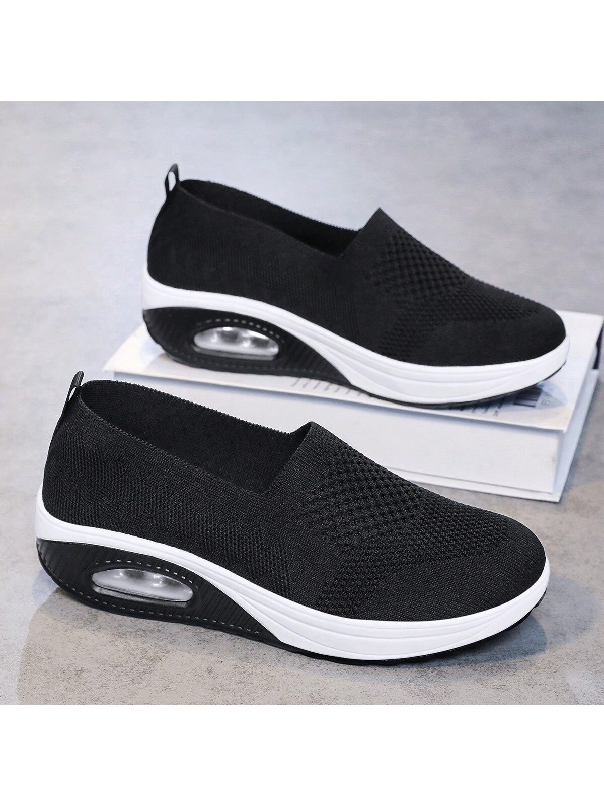 Slip-on shoes for women with knit upper, low rounded opening and thick air cushion sole - black/white