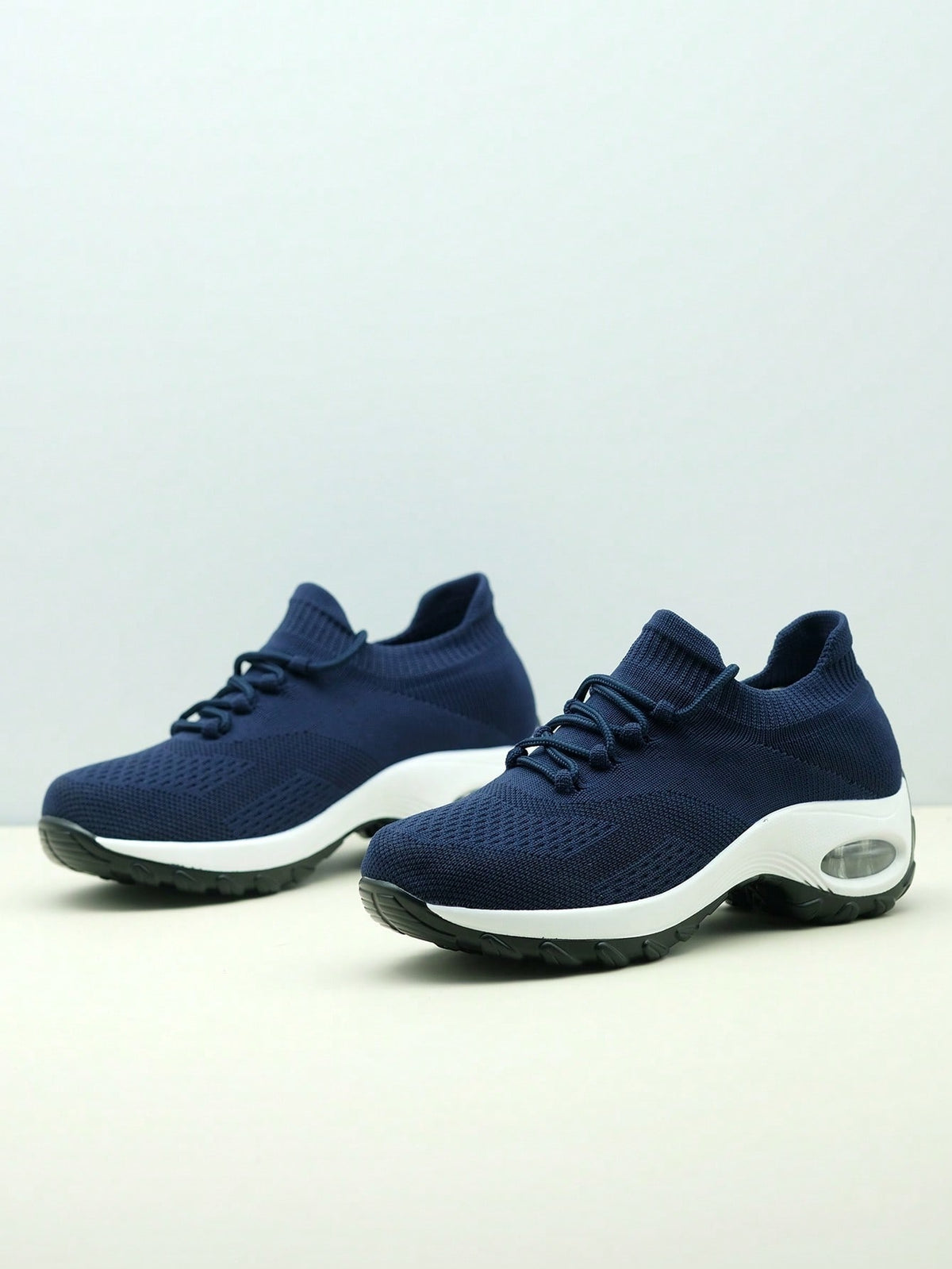 Slip-on trainers for women with knit sock collar, decorative laces and thick air cushion sole - navy