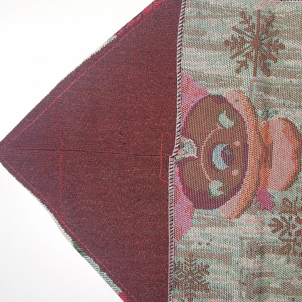 Woven Christmas table runner with a snowman at the point, snowflakes and a tassel