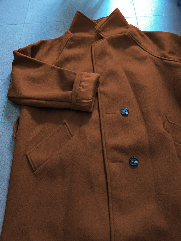 Belted longline coat with a notch lapel and welt pockets