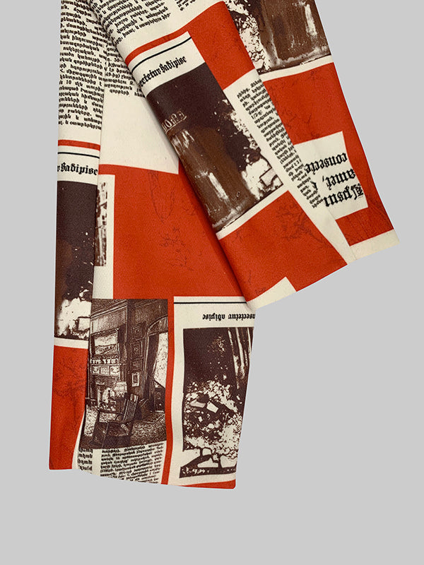 Blazer printed with newsprint columns in red and cream