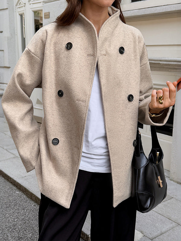 Short beige coat with a stand collar and two rows of buttons