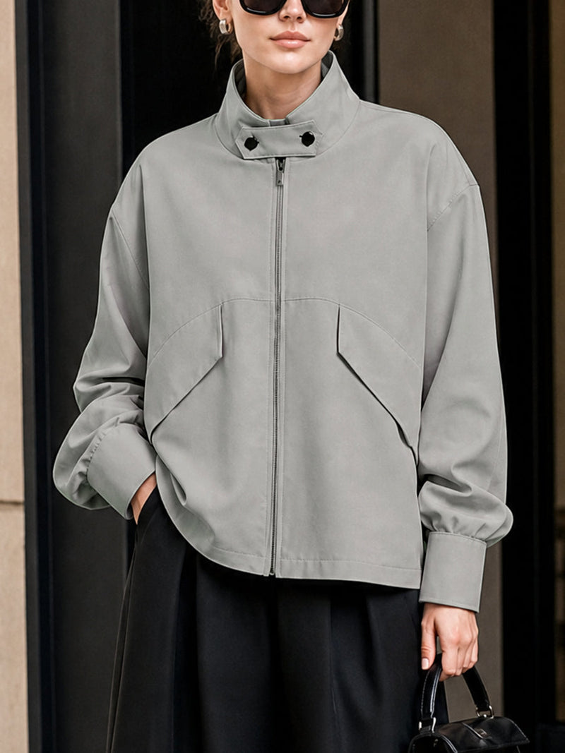 Oversized grey jacket with a high stand collar and zip front