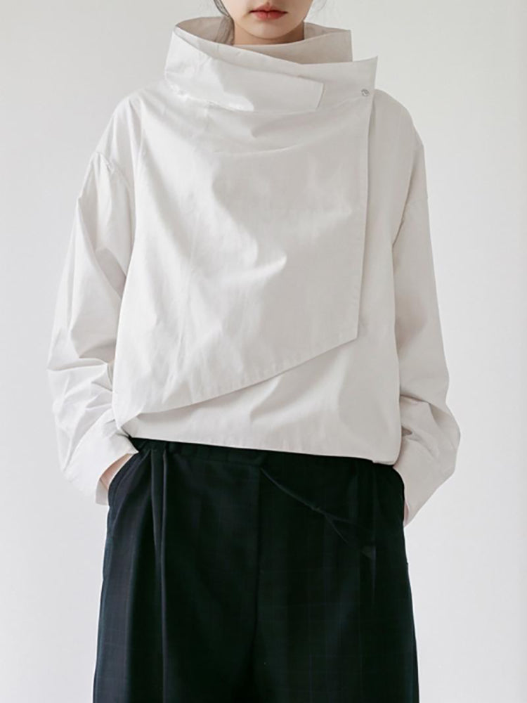Draped jacket with an asymmetric fold-over front and stand collar in white