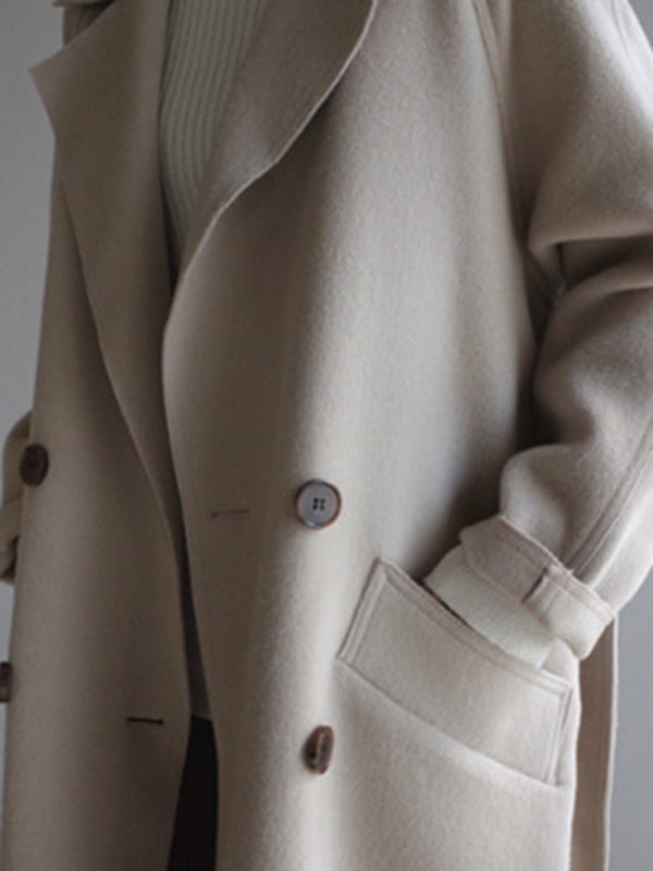 Belted longline coat with a notch lapel and welt pockets