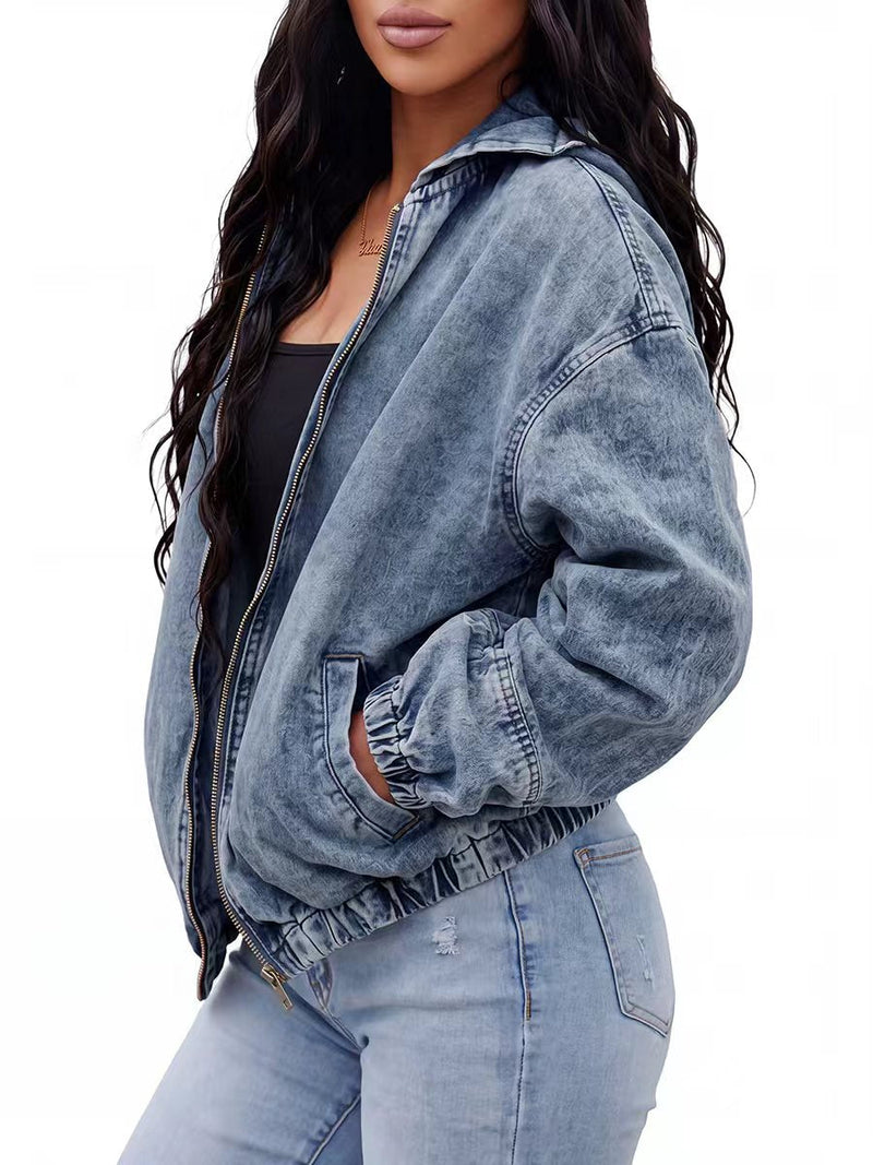 Light wash hooded denim jacket with a zip front and gathered cuffs