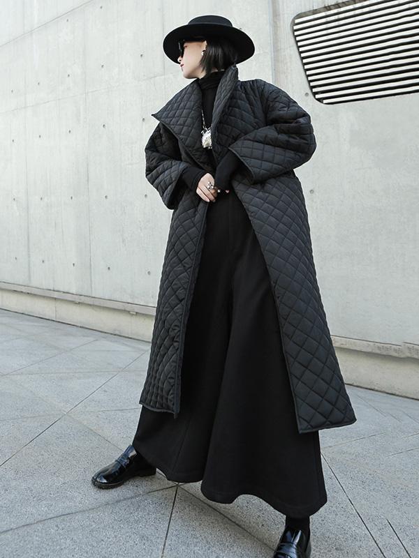 Long black quilted wrap coat with a fold-over collar and ring-buckle belt in black