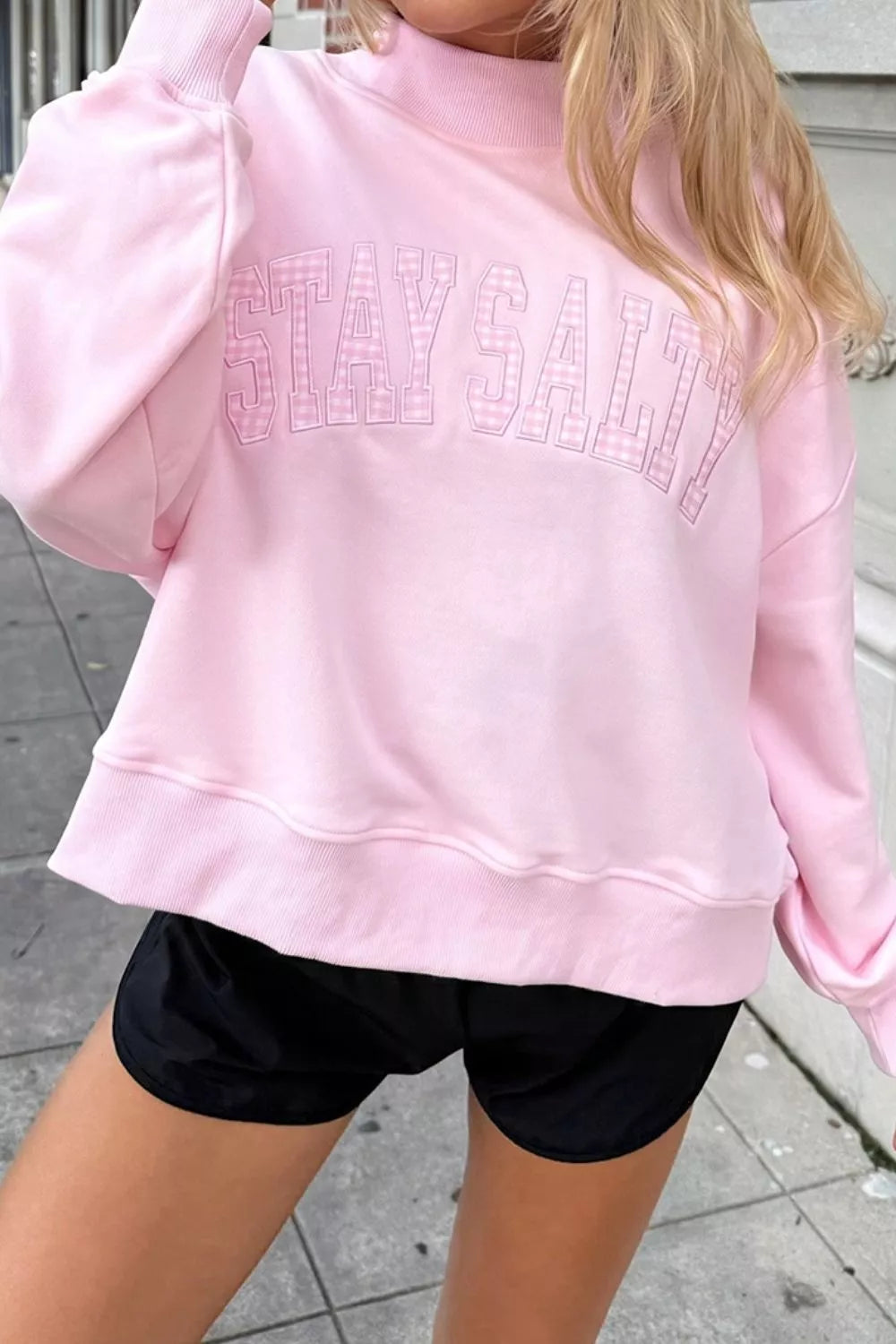 Women's embroidered stand neck sweatshirt in Blush Pink