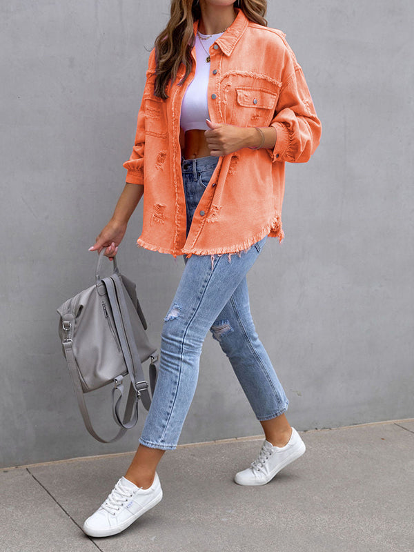 Oversized shirt jacket with frayed edges and chest pockets in orange