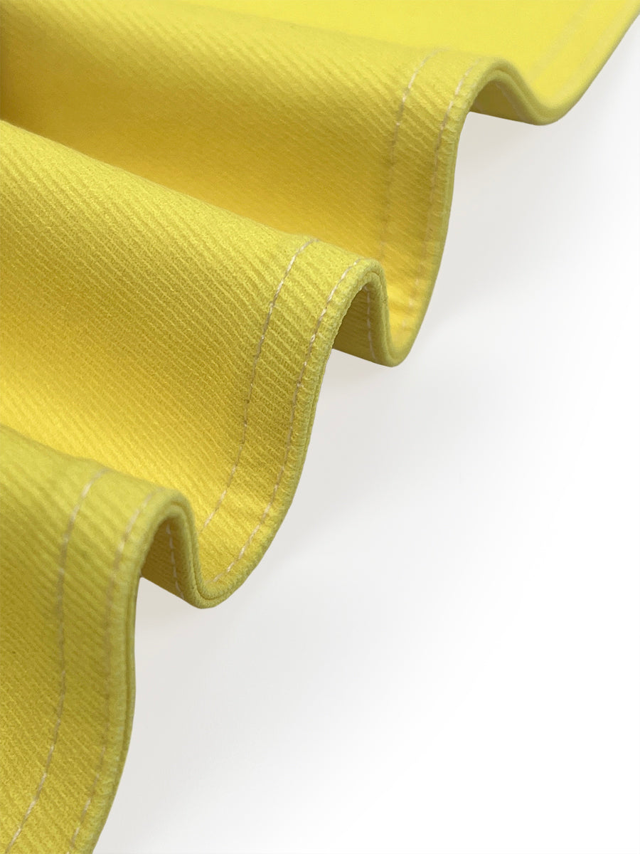 Cropped jacket fading from white at the shoulder to yellow at the hem
