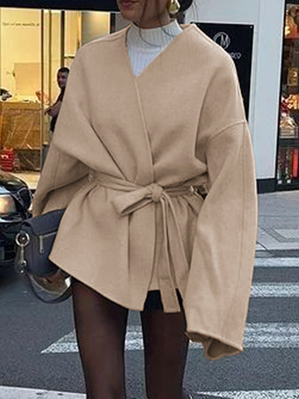 Short wrap coat with a deep V-neck and a self-tie belt