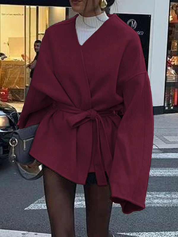 Short wrap coat with a deep V-neck and a self-tie belt