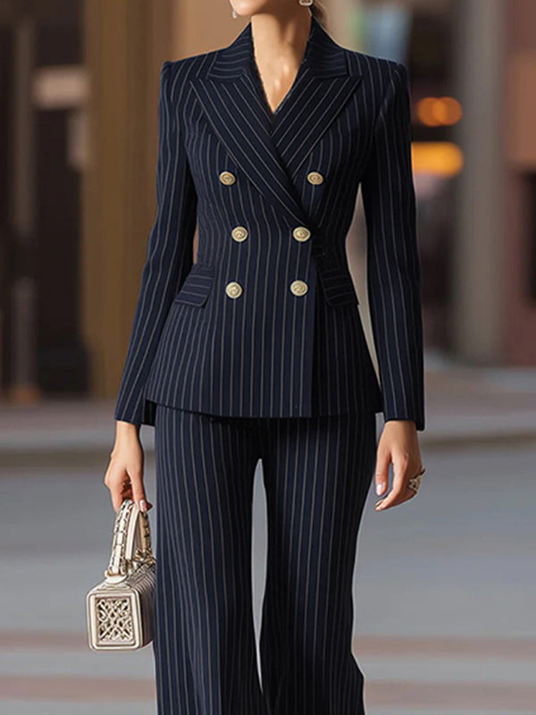 Navy pinstripe blazer with a peak lapel and gold-tone buttons in navy