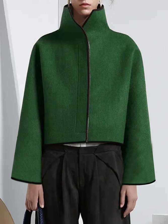 Cropped cape jacket with a high stand collar and contrast edging in olive