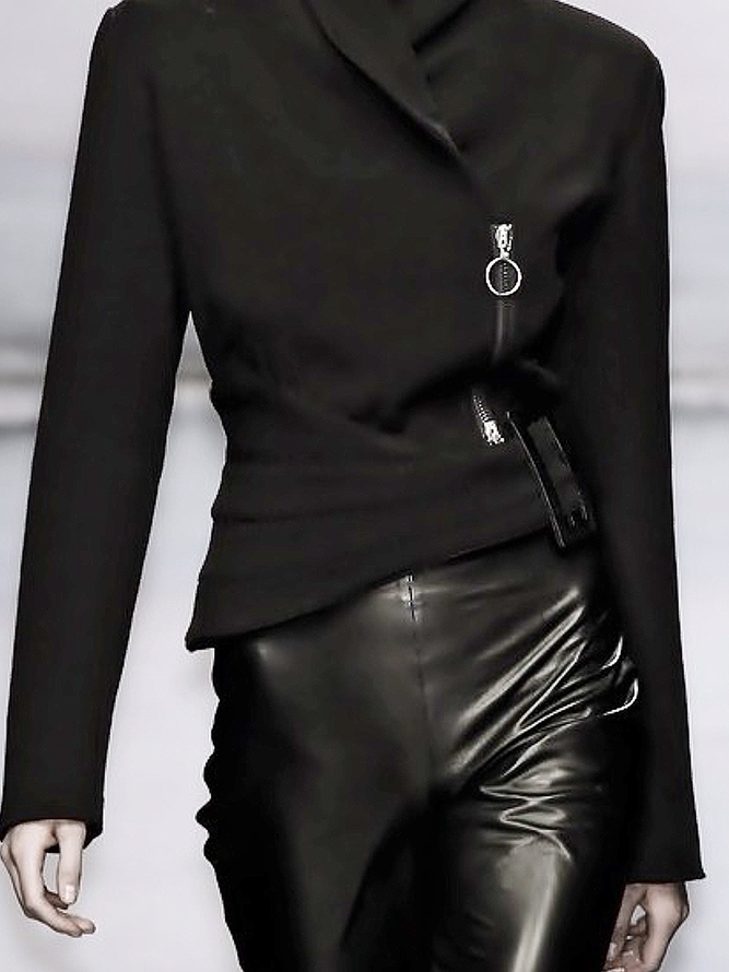 Black asymmetric jacket with a wrap front and a diagonal zip