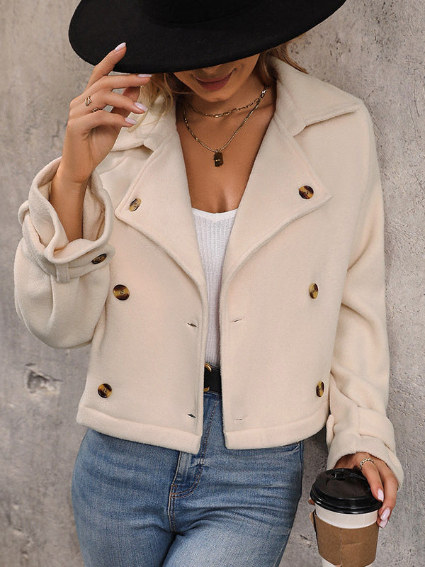 Cream cropped fleece jacket with a wide lapel and two rows of buttons in cream