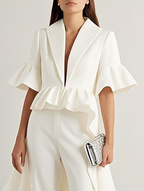 White longline blouse with a waist ruffle and flared half sleeves