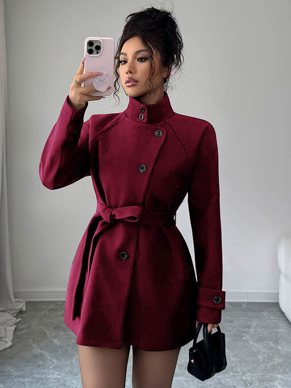 Short belted coat with a stand collar and an asymmetric button front in wine red