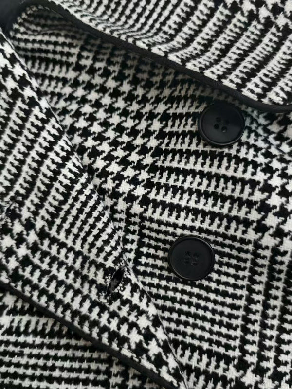 Houndstooth check jacket with an asymmetric front and fold-over collar