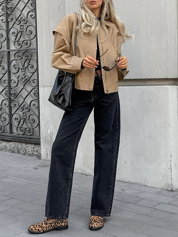 Boxy khaki utility jacket with a wide collar and flaps over the shoulder