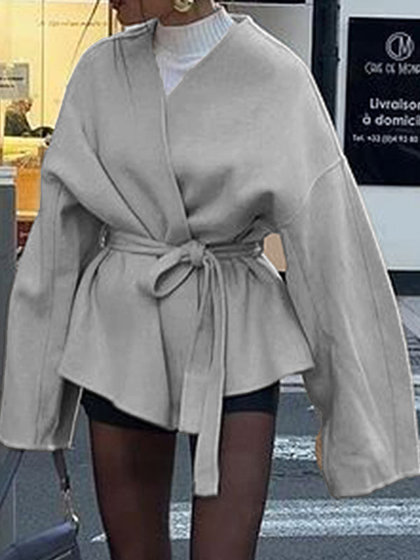 Short wrap coat with a deep V-neck and a self-tie belt