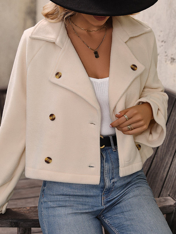 Cream cropped fleece jacket with a wide lapel and two rows of buttons