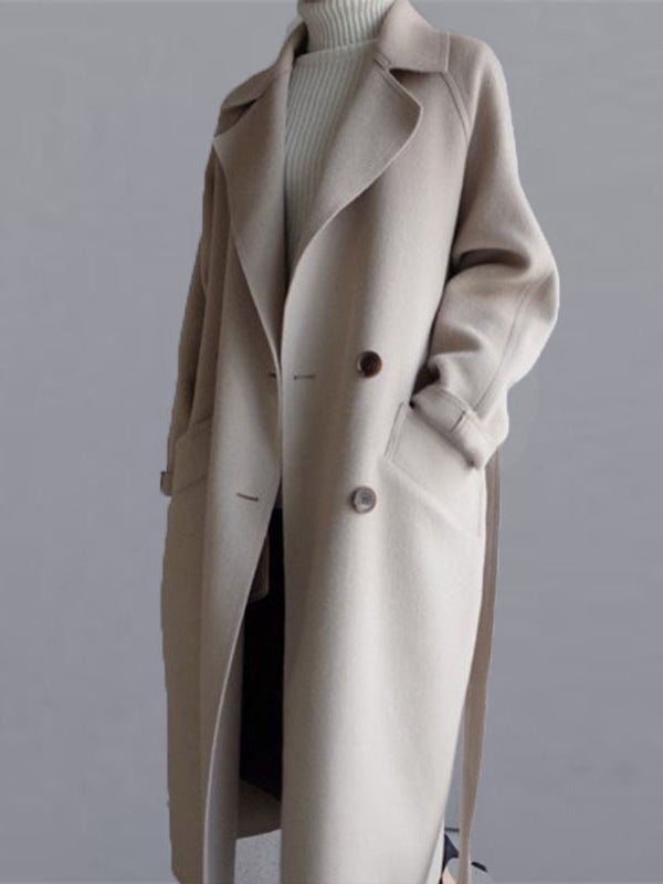 Belted longline coat with a notch lapel and welt pockets in beige