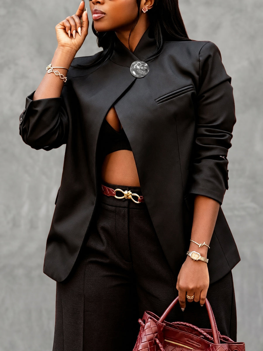 Black asymmetric jacket with a stand collar and a round clasp at the neck