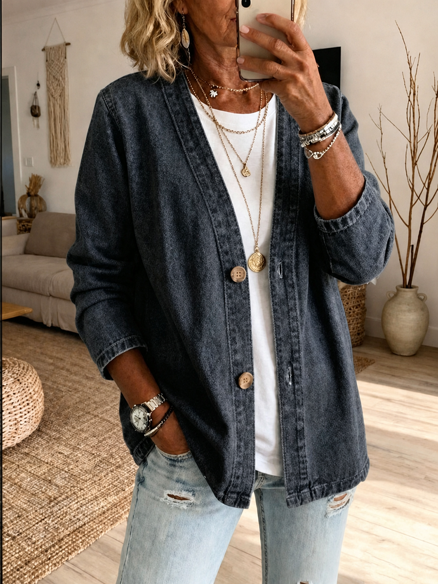 Collarless denim jacket with a button front and dropped shoulder in black