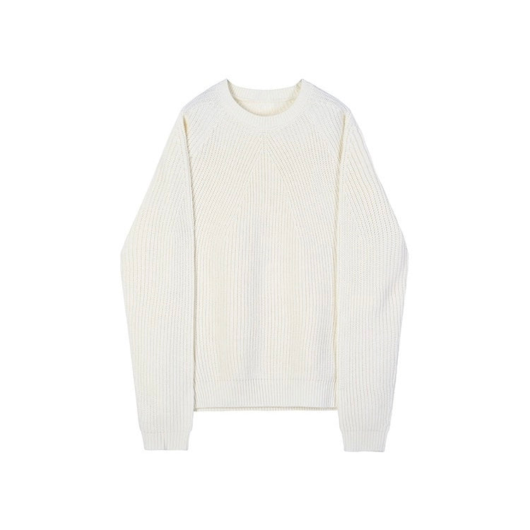 Oversized rib knit jumper worn loose over trousers