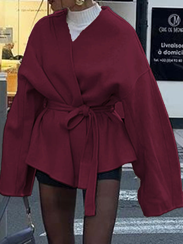 Short wrap coat with a deep V-neck and a self-tie belt