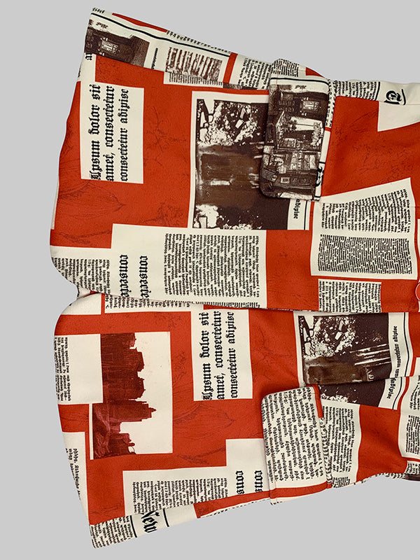 Blazer printed with newsprint columns in red and cream