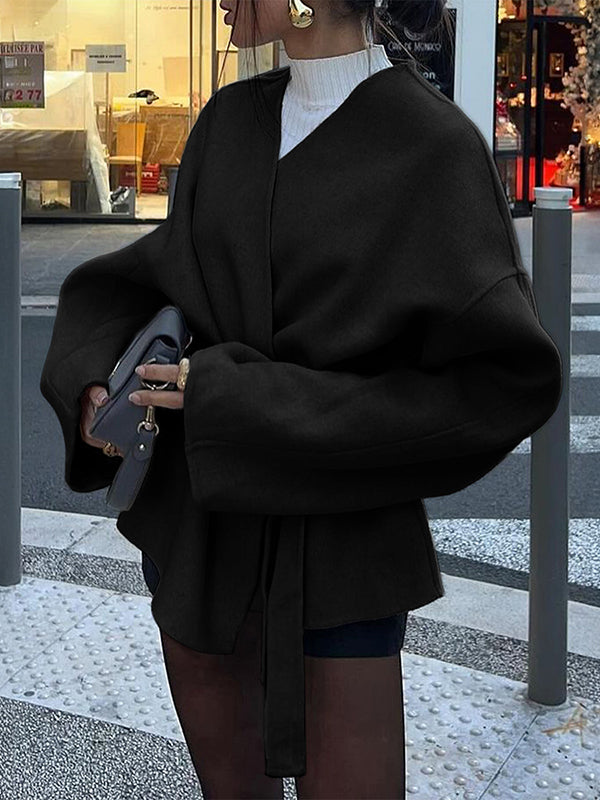 Short wrap coat with a deep V-neck and a self-tie belt