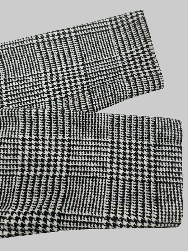Houndstooth check jacket with an asymmetric front and fold-over collar