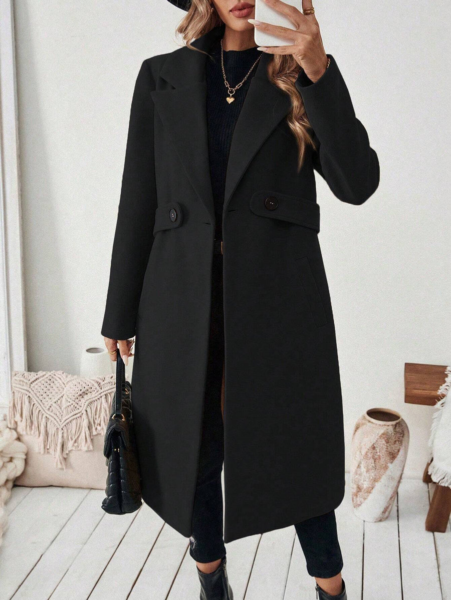 Longline coat with a wide notch lapel and a button at the waist