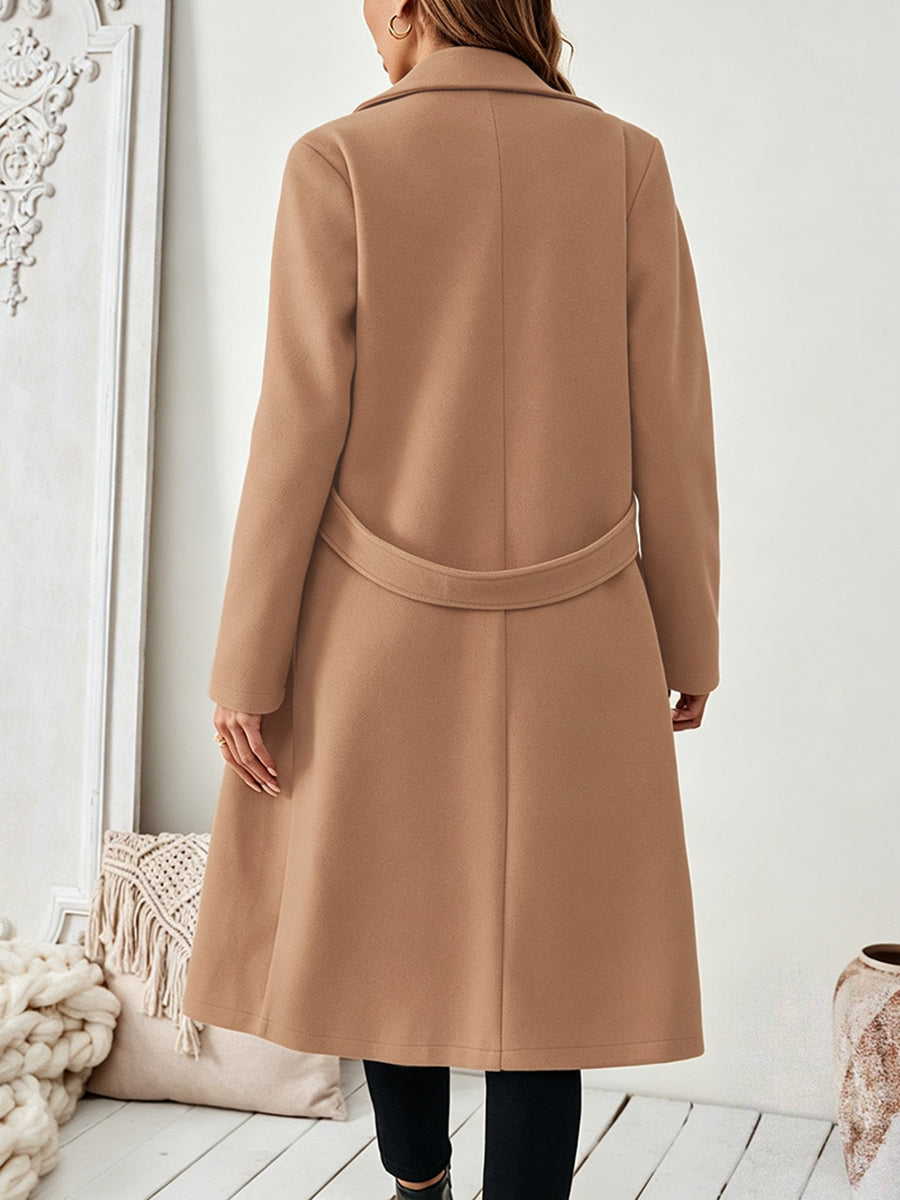 Longline coat with a wide notch lapel and a button at the waist
