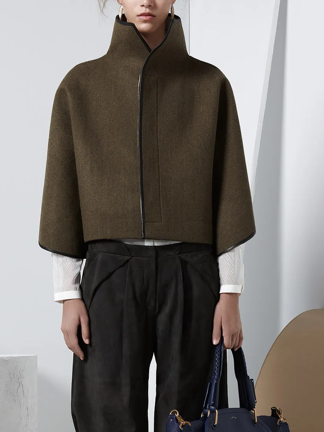 Cropped cape jacket with a high stand collar and contrast edging