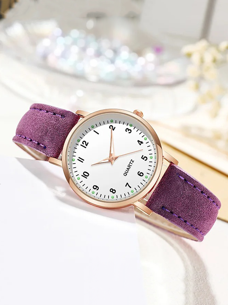 Watch with rose gold tone case and suede look strap