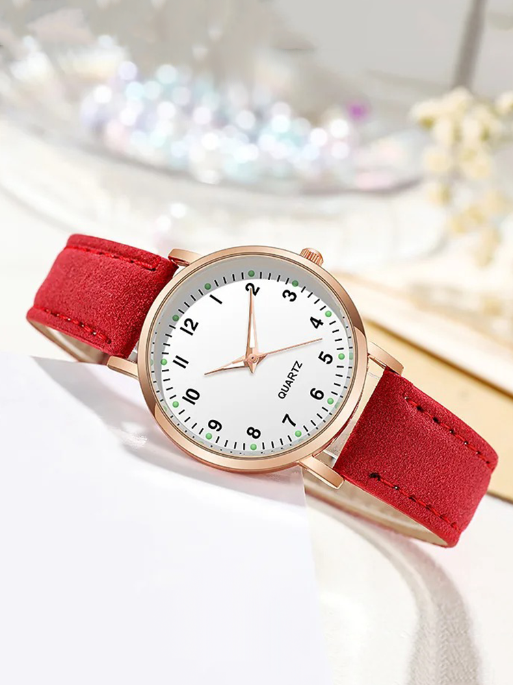 Watch with rose gold tone case and suede look strap