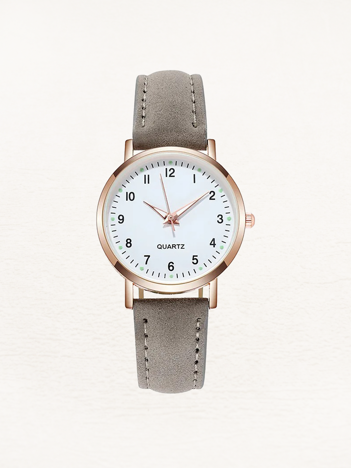 Watch with rose gold tone case and suede look strap