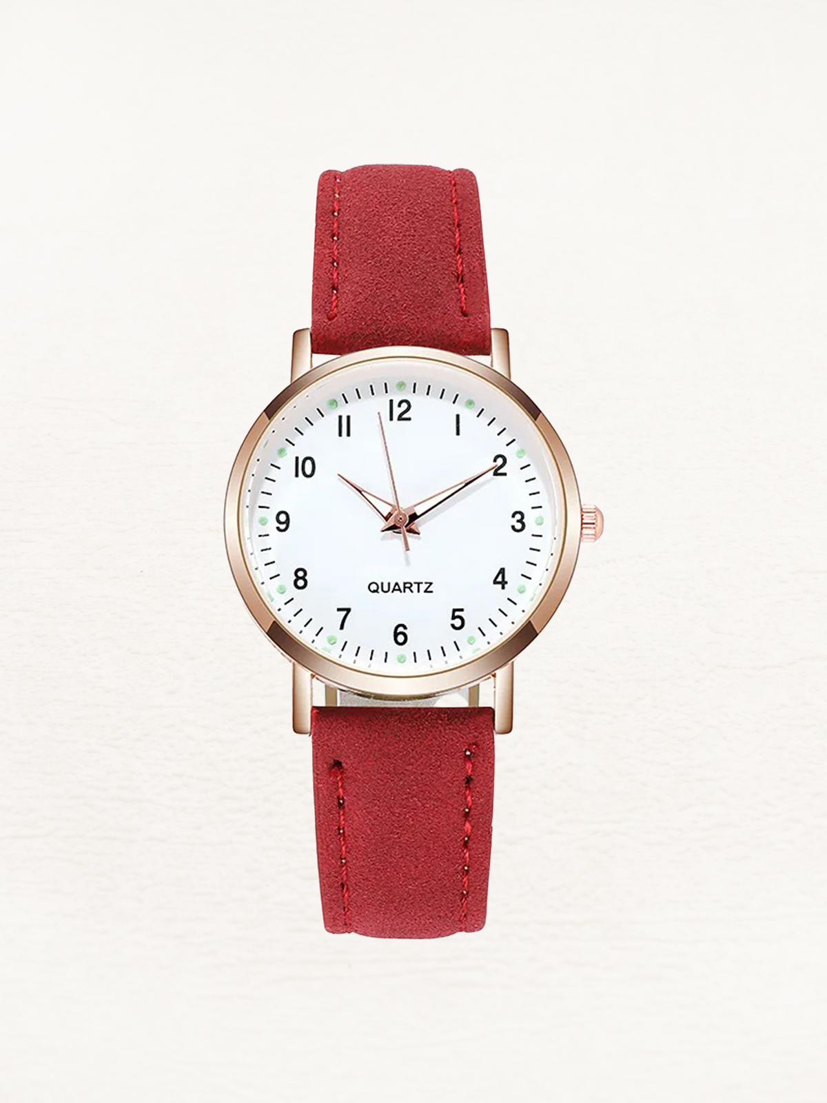 Watch with rose gold tone case and suede look strap