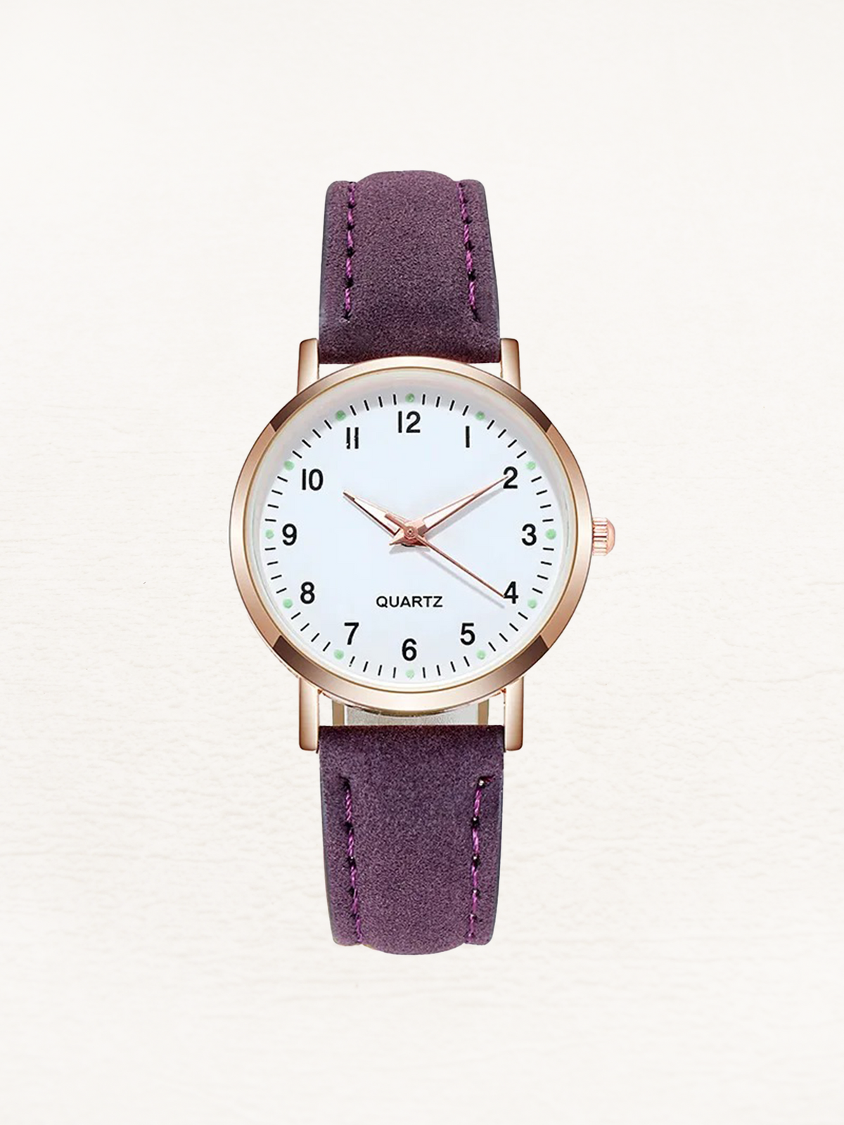 Watch with rose gold tone case and suede look strap