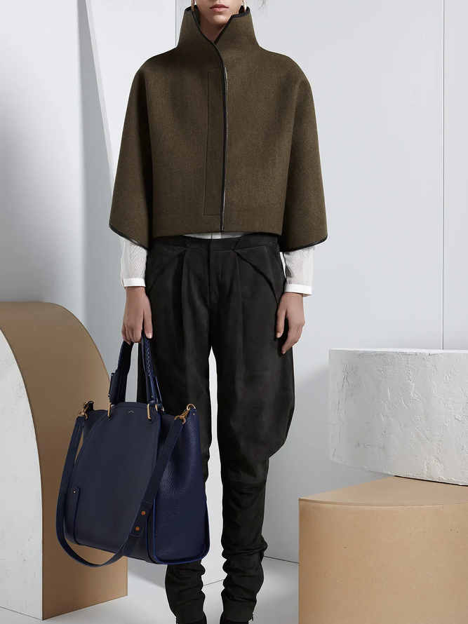 Cropped cape jacket with a high stand collar and contrast edging