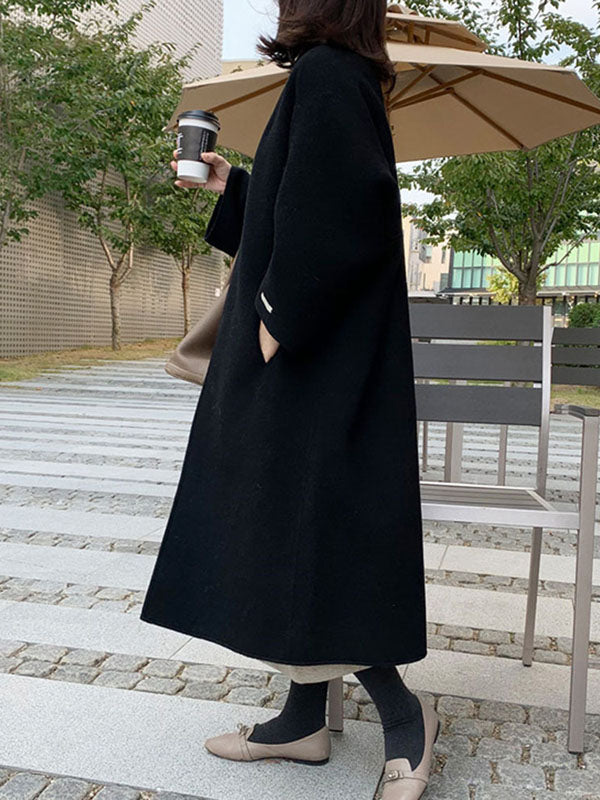 Collarless longline coat with dropped sleeves and an open front in navy