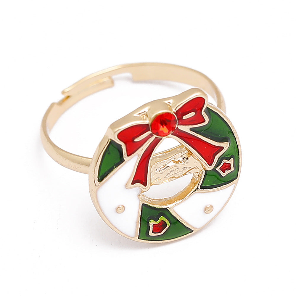 Adjustable gold-tone Christmas ring with an open band and a festive motif - wreath
