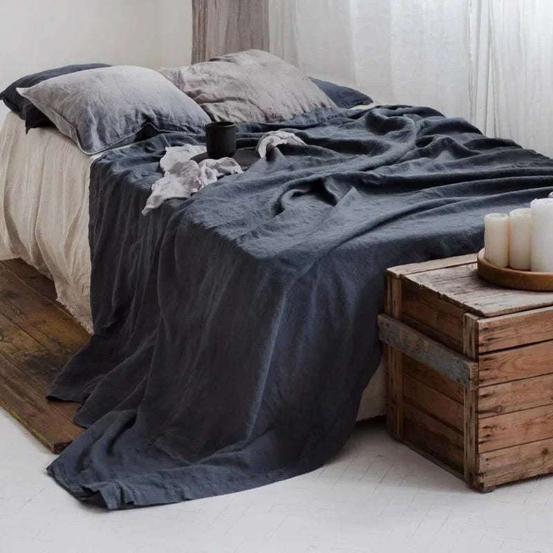 Airy woven sheet with a washed look on a bed - dark grey