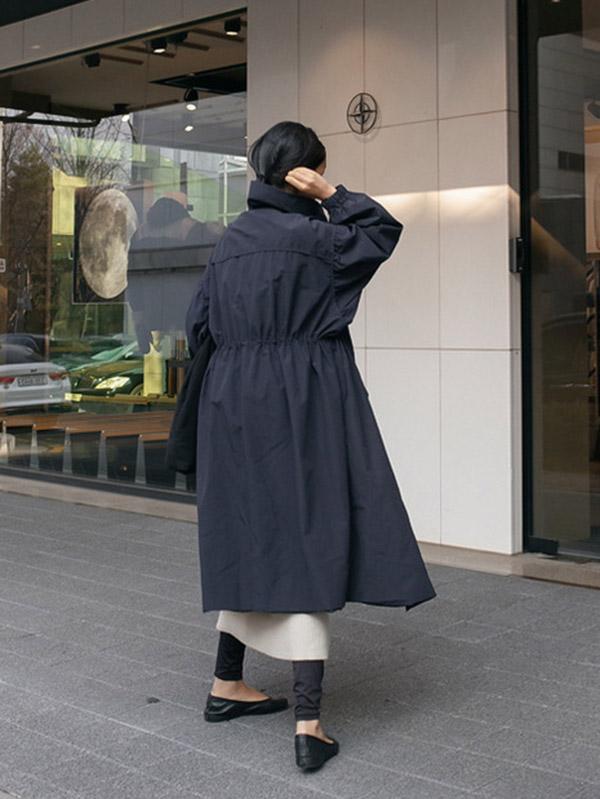 Longline hooded coat with a drawstring waist and deep pockets