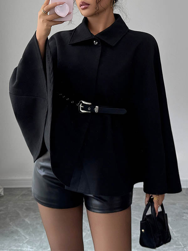 Black cape coat with a shirt collar and a buckled belt at the waist in black